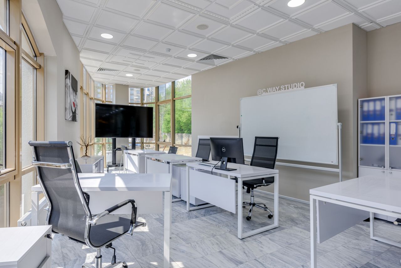 Careers Spacious and bright modern office interior with sleek furniture, ideal for professional workspaces.